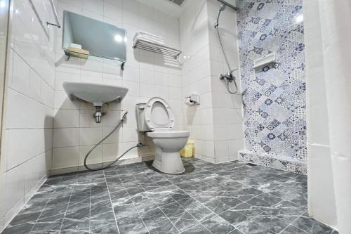 a bathroom with a toilet and a shower at Pure Phuket Residence in Phuket