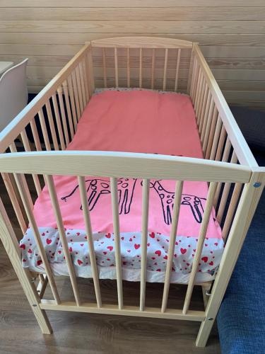 Una cama o camas en una habitación de Tiny House Cēsis