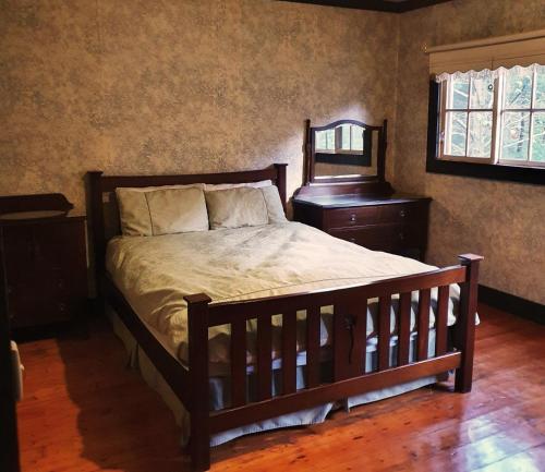 Katil atau katil-katil dalam bilik di Walhalla Guesthouses