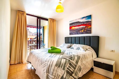 Giường trong phòng chung tại Lovely 1-bedroom apartment whit pool