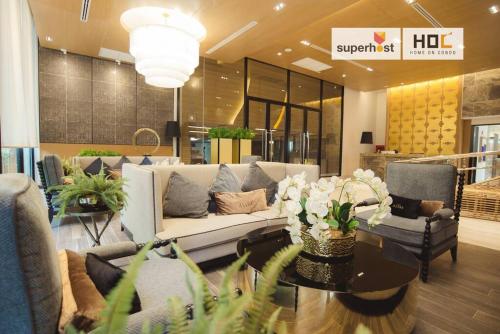 a lobby with a couch and chairs in a store at Luxury 2-Bedroom Condo with Pool in Chiang Mai