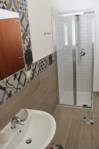 a bathroom with a sink and a shower at B&B San Valentino in Mafalda
