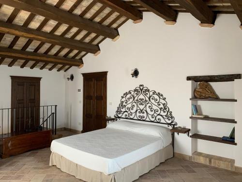 Ένα ή περισσότερα κρεβάτια σε δωμάτιο στο ANPEMO Casa Vacanze