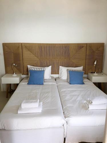 Ένα ή περισσότερα κρεβάτια σε δωμάτιο στο Apanema Villas, Mykonos