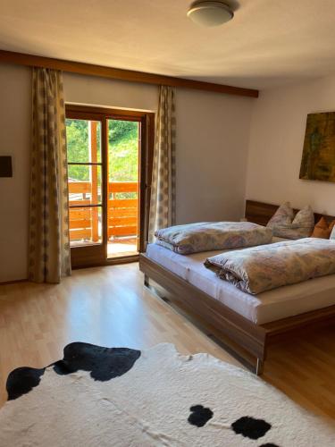 Postel nebo postele na pokoji v ubytování Schneiderhaus