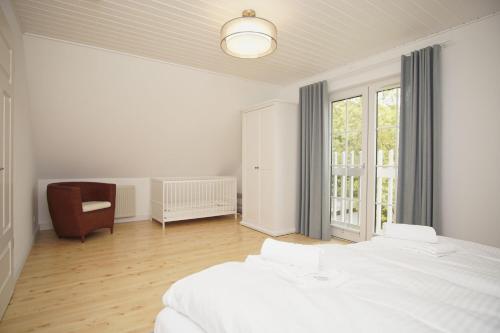 Кровать или кровати в номере Ferienhaus Wiking Haus - Terrasse und Garten