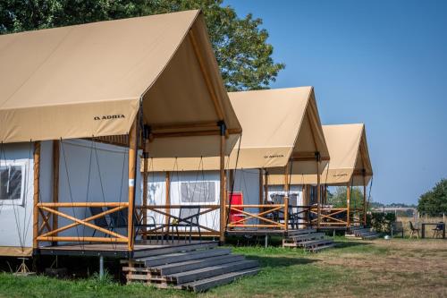 a row of tents in a field at EuroParcs Gulperberg in Gulpen