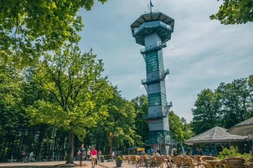 a tower in a park with people walking around it at EuroParcs Gulperberg in Gulpen