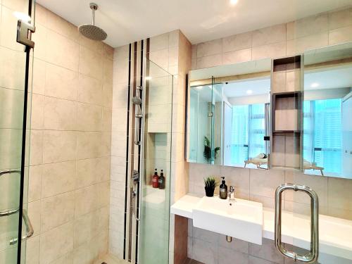 a bathroom with a sink and a shower at Robertson Suites by Sleepy Bear, Bukit Bintang in Kuala Lumpur