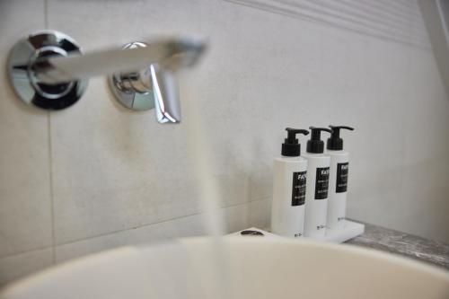 a close up of a bathroom sink with a faucet at WestCord Hotel de Wadden in Oost-Vlieland