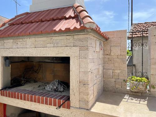 a brick oven with a fire inside of it at Villa Sv. Vid in Sevid