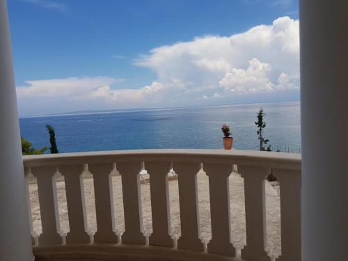 a view of the ocean from a balcony at Deep Blue Villas in Vasilikos