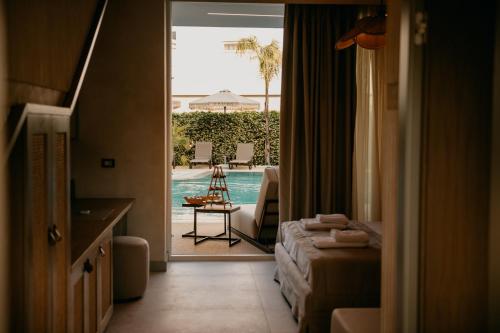 a hotel room with a view of a swimming pool at Elite Bay Hotel Lalez Durres in Lalëz