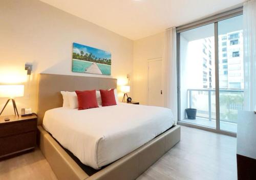 מיטה או מיטות בחדר ב-Global Rent Apart - Costa Hollywood