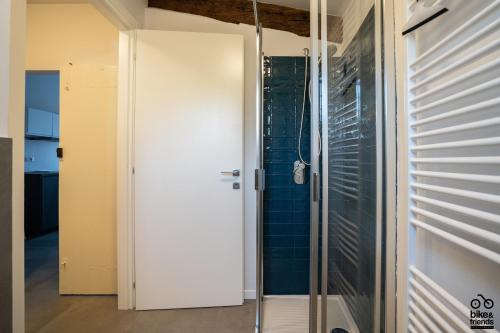 a glass door in a bathroom with a shower at MONOLOCALE LE RONDINI centralissimo in Pesaro