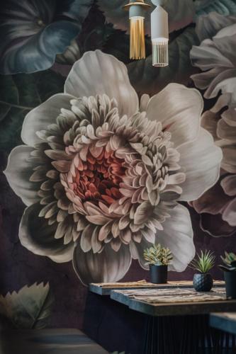 a mural of a large flower on a wall at Hôtel Prince Albert Gare de Lyon in Paris