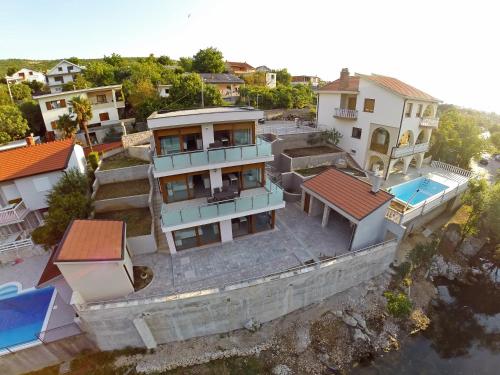 an aerial view of a house next to the water at Buna Spring Apartments in Mostar