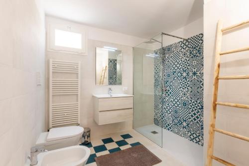 a bathroom with a toilet and a shower at Civico 22 B&B in Cannole