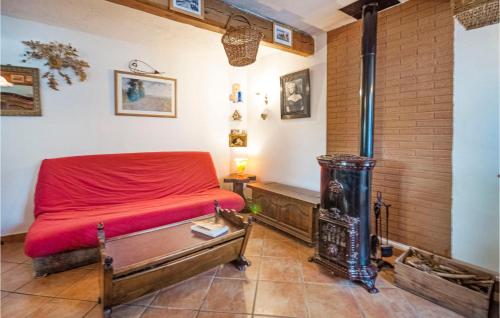 a bedroom with a bed and a wood stove at Stunning Home In Andon With Kitchen in Andon