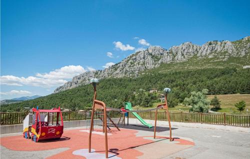 a playground with a mountain in the background at Stunning Home In Andon With Kitchen in Andon