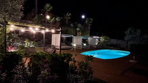 a swimming pool in a yard at night at Charming Bellagio Boutique Hotel in Bellagio