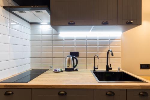 Кухня или мини-кухня в Central Apartments Maidan Area
