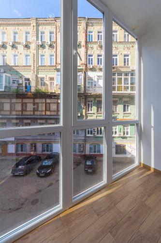 a room with a window with a view of a building at Secret Apartments in Kyiv
