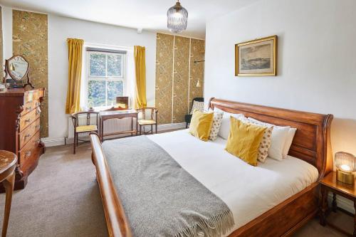 a bedroom with a bed and a desk and a window at Host & Stay - Elliott Terrace in Wark
