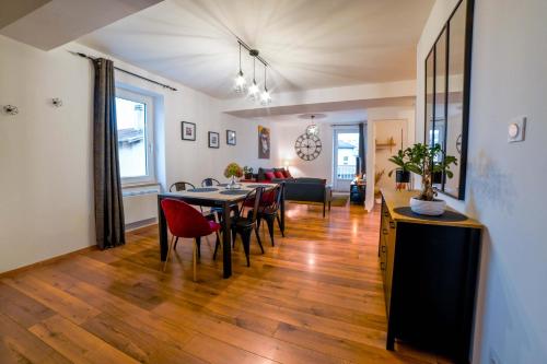 a dining room and living room with a table and chairs at The Eighteen _ Hyper-centre - T3 de 65m² - 8 Pers. in Voiron