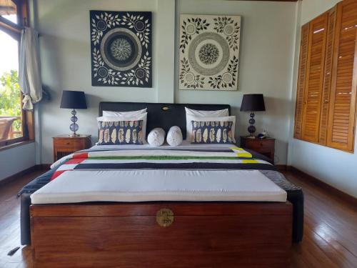 Llit o llits en una habitació de Villa Juliani Lovina Bali