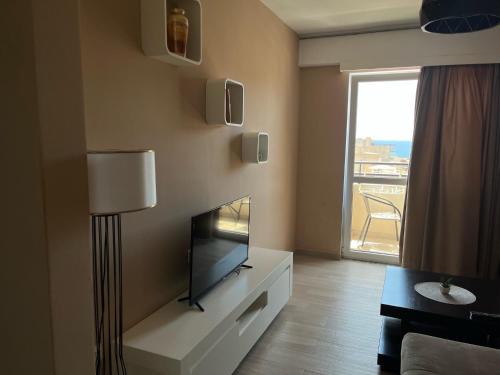 a living room with a flat screen tv on a wall at Bella Vista B&B in Ulcinj