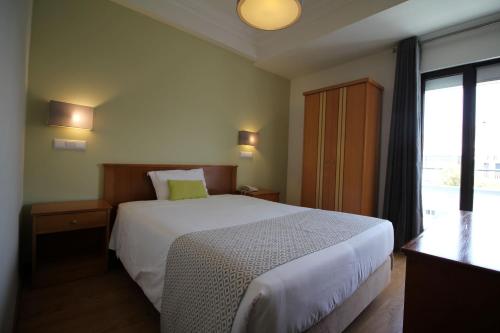 Katil atau katil-katil dalam bilik di Imperador Hotel