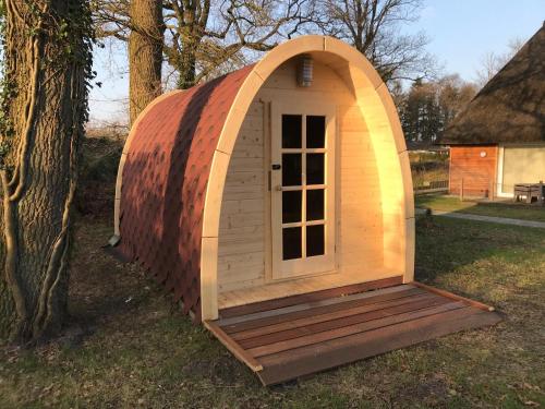 a dome house with a window in a yard at Residenz - Pedelec - Penthouse - Sauna - Parkplatz in Bad Zwischenahn