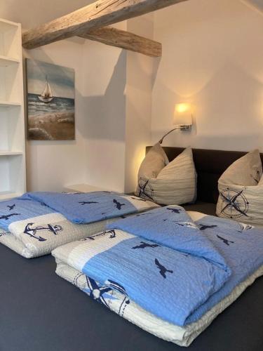 Säng eller sängar i ett rum på Pappelhof - Doppelhaushälfte mit Garten in Grömitz