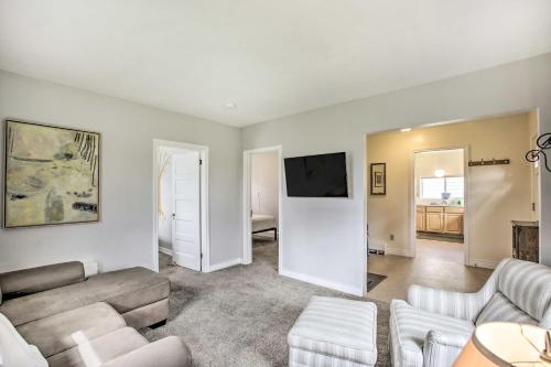 a living room with a couch and a tv at Lovely Thermopolis Home Less Than 3 Mi to Hot Springs in Thermopolis