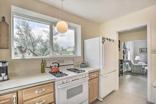 a kitchen with a stove and a refrigerator at Lovely Thermopolis Home Less Than 3 Mi to Hot Springs in Thermopolis