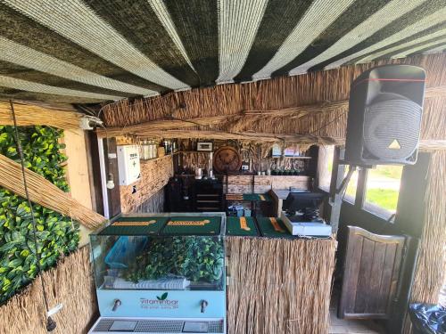 a food truck with a bar and a speaker at SupVamaVeche in Vama Veche