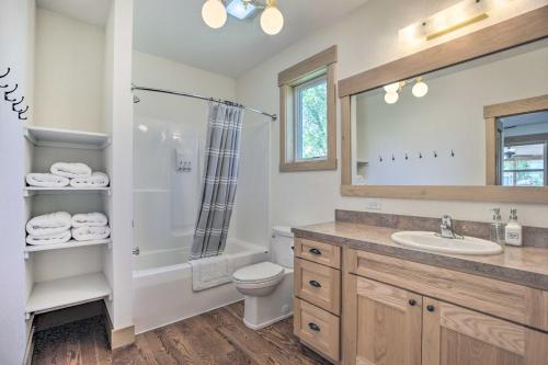 a bathroom with a shower toilet and a sink at Idyllic Gem Screened Porch, half Mi to River! in Thermopolis