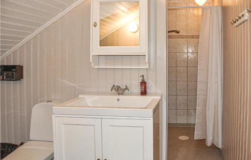a white bathroom with a sink and a shower at Cozy Home In Lesjöfors With Kitchen in Lesjöfors