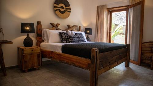 Postel nebo postele na pokoji v ubytování Tamu Tamu Boutique Hotel