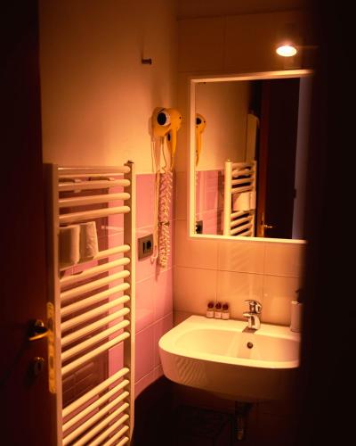 a bathroom with a sink and a mirror at SPIEDO IMPERIALE - Locanda e Ristorante in Cotignola