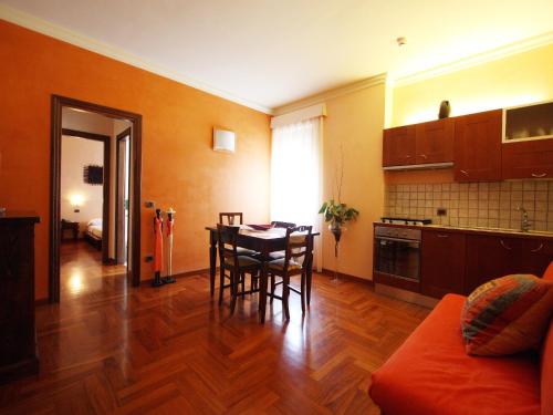 a kitchen and dining room with a table and chairs at Casa Dei Mercanti Town House in Lecce
