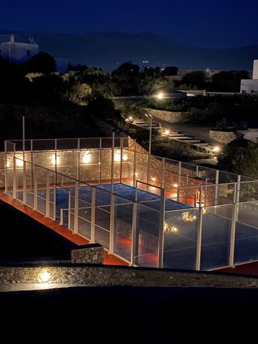 a building with a ramp at night with lights at Paros Agnanti Resort & Spa in Parikia