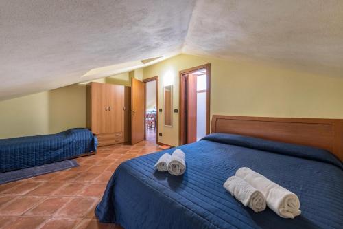 En eller flere senge i et værelse på Casa Caterina Mansarda vista Lago