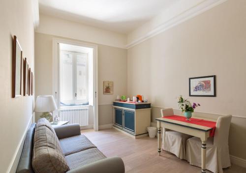 a living room with a table and a couch at Palazzo Vittoli - Irpinia in Castelfranci