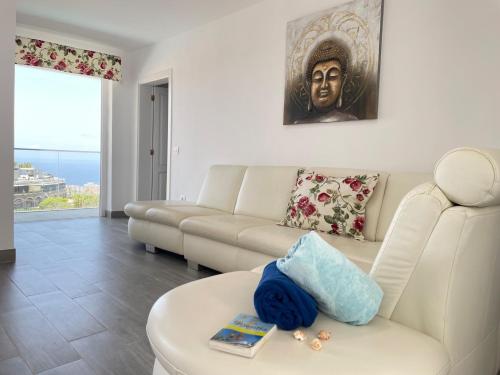 a living room with a couch and a table at Adeje Deluxe Villas Santa Mónica in Adeje