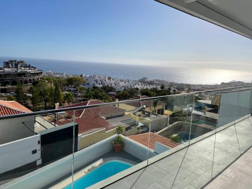 a view of the ocean from the balcony of a house at Adeje Deluxe Villas Santa Mónica in Adeje