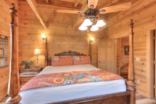 a bedroom with a bed in a log cabin at RiverStone Condo Resort & Spa in Pigeon Forge