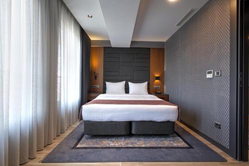 Ένα ή περισσότερα κρεβάτια σε δωμάτιο στο Nova Vista Deluxe & Suites a Member of Radisson Individuals