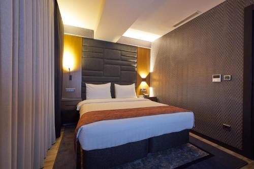 Ένα ή περισσότερα κρεβάτια σε δωμάτιο στο Nova Vista Deluxe & Suites a Member of Radisson Individuals